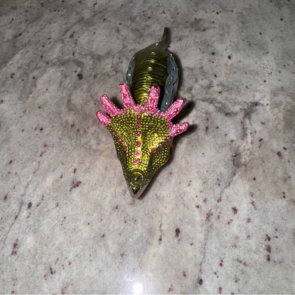 green, light blue, and gold Zuniceratops trinket